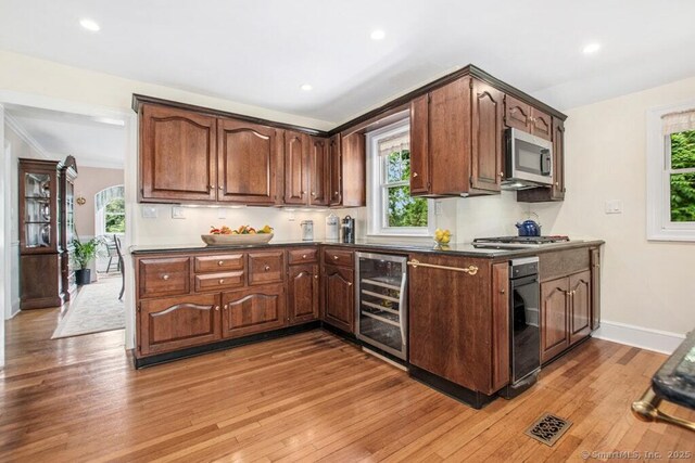 15 Devonshire Dr, Darien, CT 06820 - kitchen with wine cooler, stainless steel appliances, plenty of natural light, and recessed lighting