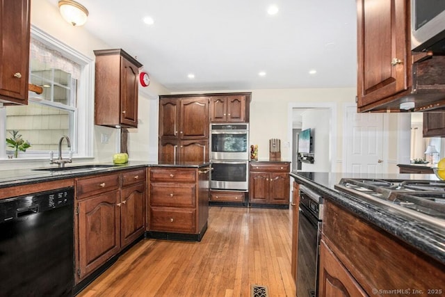 15 Devonshire Dr, Darien, CT 06820 - kitchen featuring stainless steel appliances, light wood-style floors, recessed lighting, and dark stone counters