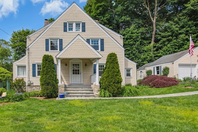 15 Devonshire Dr, Darien, CT 06820 - view of front of home with a chimney, a front lawn, and a garage