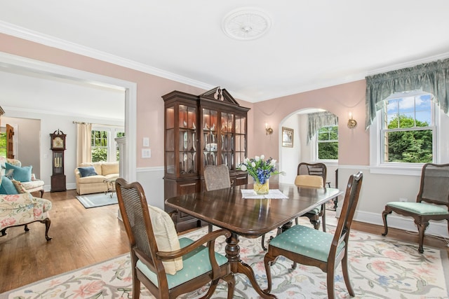 15 Devonshire Dr, Darien, CT 06820 - dining space with plenty of natural light, arched walkways, light wood-style floors, and ornamental molding