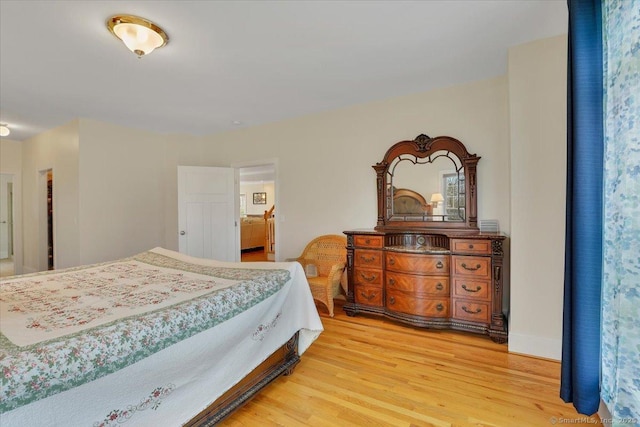 bedroom featuring light wood-style flooring
