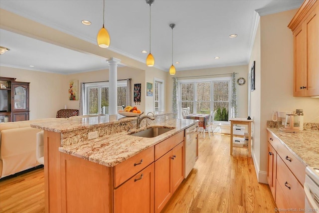 kitchen with open floor plan, a sink, dishwasher, light wood-type flooring, and crown molding