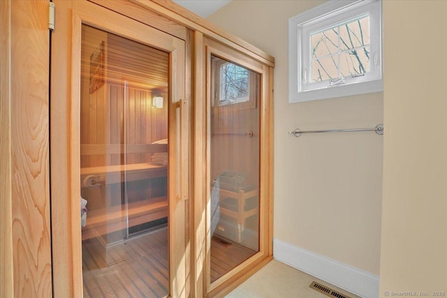 relaxing sauna featuring baseboards