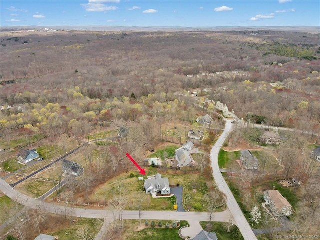 aerial view of property's location with a forest