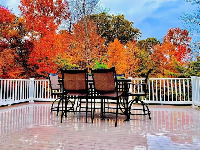 wooden deck with outdoor dining area