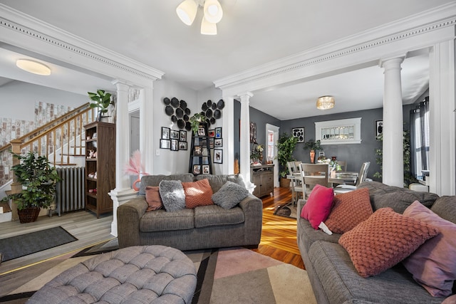 87 Englewood Ave, Waterbury, CT 06705 - living room with ceiling fan, decorative columns, ornamental molding, and stairway