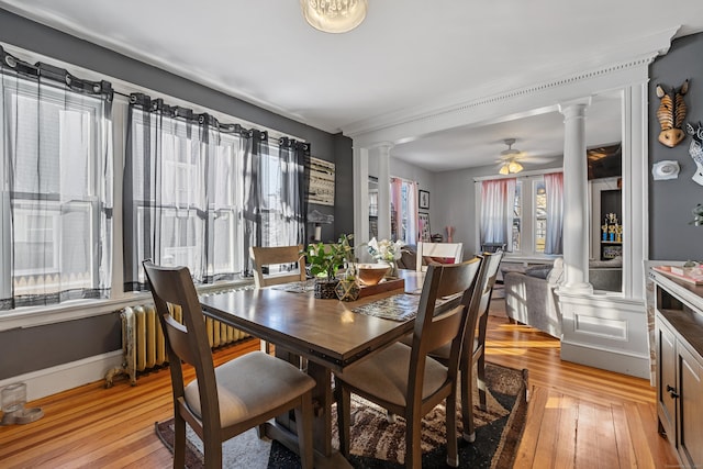 87 Englewood Ave, Waterbury, CT 06705 - dining area featuring light wood-style flooring, a ceiling fan, and decorative columns