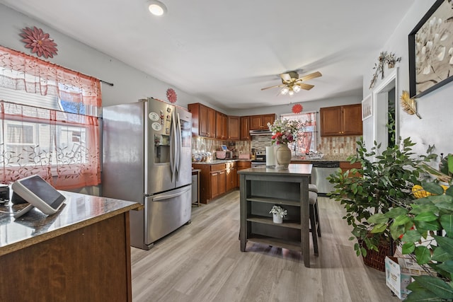 87 Englewood Ave, Waterbury, CT 06705 - kitchen with light wood-style floors, backsplash, a ceiling fan, open shelves, and appliances with stainless steel finishes
