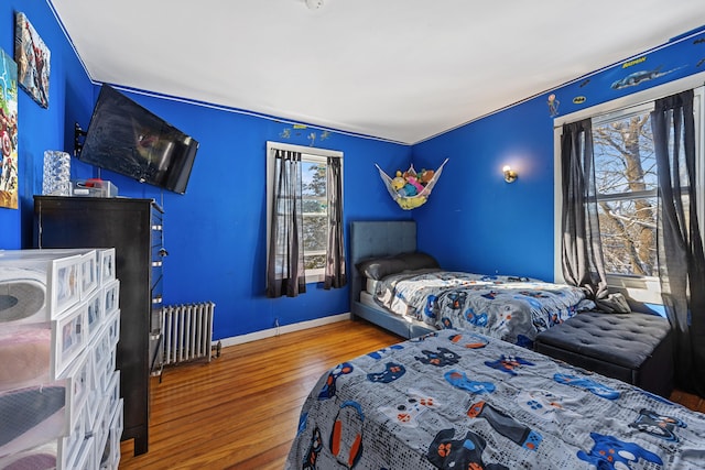 87 Englewood Ave, Waterbury, CT 06705 - bedroom featuring radiator, wood finished floors, and baseboards