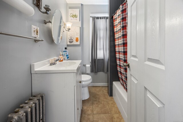 87 Englewood Ave, Waterbury, CT 06705 - bathroom featuring tile patterned flooring, radiator heating unit, toilet, and vanity