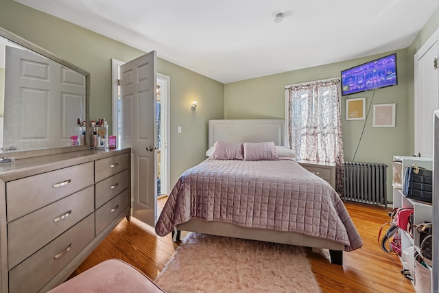 87 Englewood Ave, Waterbury, CT 06705 - bedroom featuring radiator heating unit and light wood-style floors