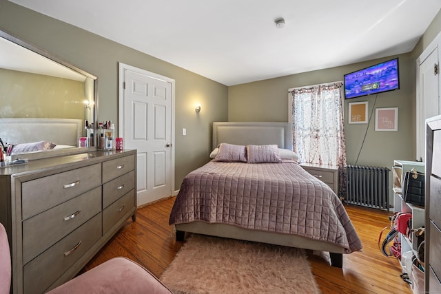 87 Englewood Ave, Waterbury, CT 06705 - bedroom featuring radiator heating unit and wood finished floors