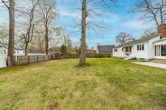 33 Wagon Rd, Enfield, CT 06082 - view of yard with a fenced backyard, an outdoor structure, and a shed