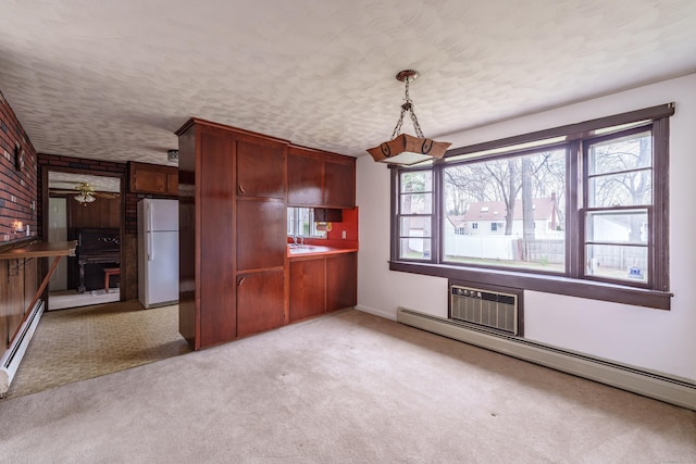 33 Wagon Rd, Enfield, CT 06082 - unfurnished dining area with a baseboard heating unit, light carpet, and a ceiling fan
