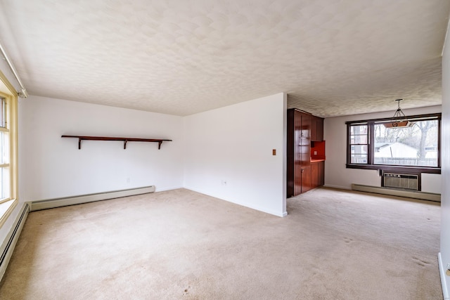 33 Wagon Rd, Enfield, CT 06082 - unfurnished living room with a baseboard heating unit, a textured ceiling, a baseboard radiator, and light carpet