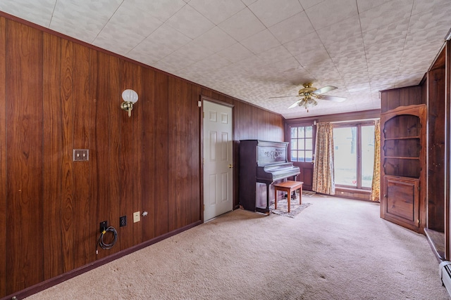 33 Wagon Rd, Enfield, CT 06082 - interior space with baseboard heating, a ceiling fan, and wooden walls