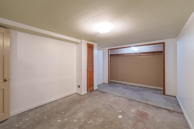 33 Wagon Rd, Enfield, CT 06082 - unfurnished bedroom with baseboards and concrete flooring