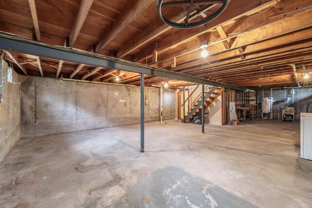 33 Wagon Rd, Enfield, CT 06082 - unfinished below grade area with water heater and stairs
