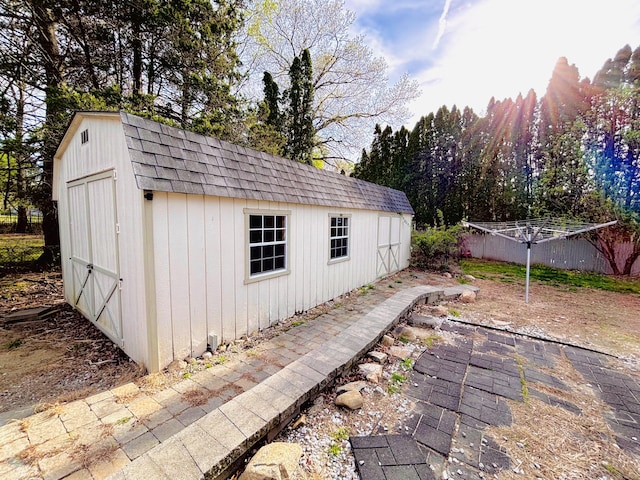 view of shed with fence