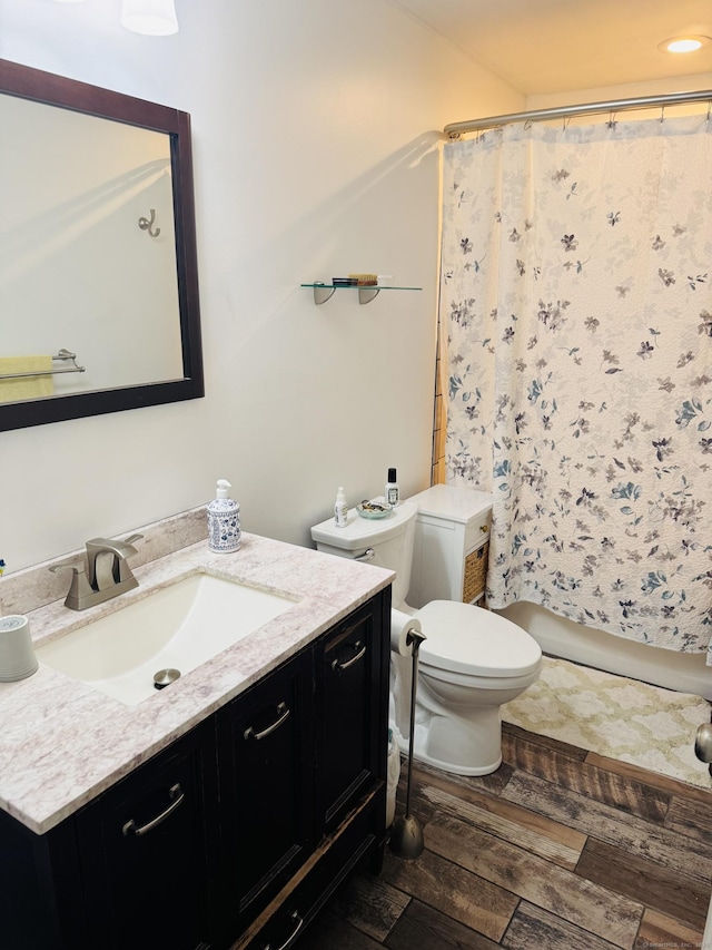 full bathroom with toilet, vanity, and a shower with curtain