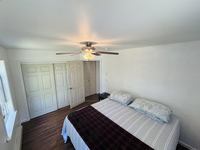 bedroom with a closet, a baseboard radiator, ceiling fan, and dark wood-style floors