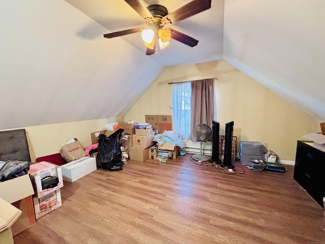 bonus room featuring lofted ceiling, a ceiling fan, and wood finished floors