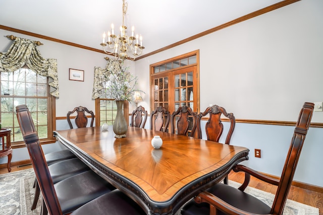 3 Huntington Ln, New Fairfield, CT 06812 - dining space with a chandelier, wood finished floors, baseboards, and ornamental molding