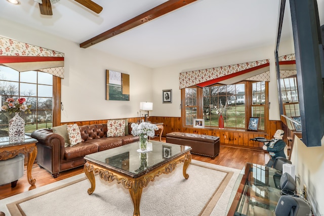 3 Huntington Ln, New Fairfield, CT 06812 - living room with a wainscoted wall, wood finished floors, wood walls, a ceiling fan, and beamed ceiling