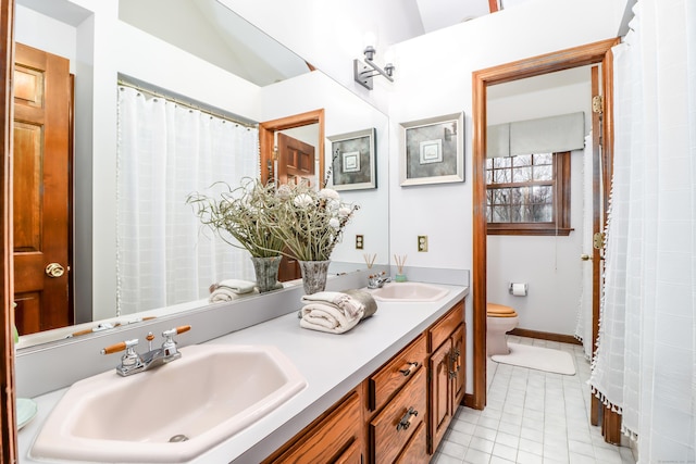 3 Huntington Ln, New Fairfield, CT 06812 - bathroom with toilet, double vanity, and tile patterned floors