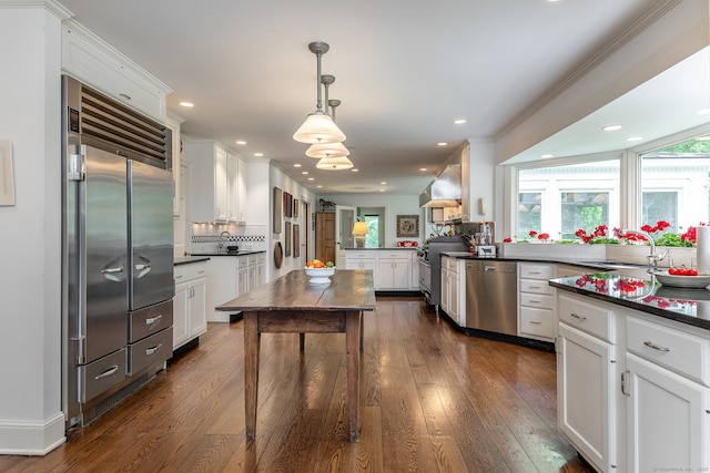 8 Bayberry Hl, Roxbury, CT 06783 - kitchen featuring high end appliances, dark countertops, a peninsula, white cabinets, and recessed lighting