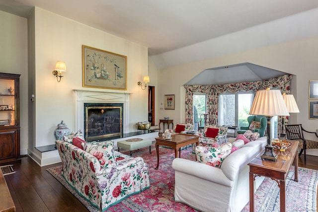 8 Bayberry Hl, Roxbury, CT 06783 - living area with hardwood / wood-style flooring, a glass covered fireplace, lofted ceiling, and baseboards