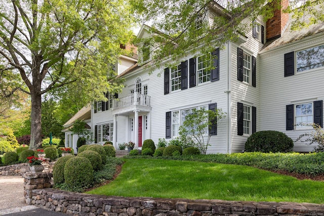 8 Bayberry Hl, Roxbury, CT 06783 - georgian-style home with a balcony, a chimney, and a front yard