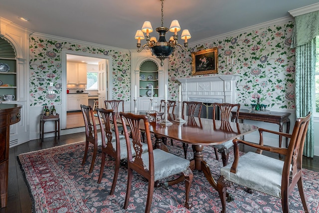 8 Bayberry Hl, Roxbury, CT 06783 - dining space with wallpapered walls, crown molding, a chandelier, dark wood-style flooring, and a fireplace