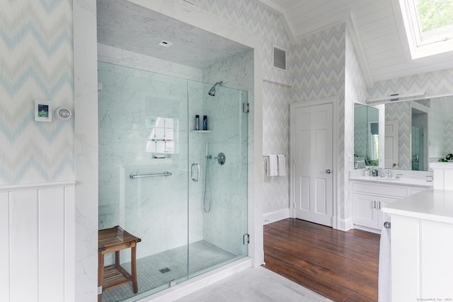 8 Bayberry Hl, Roxbury, CT 06783 - full bath with a stall shower, wallpapered walls, a skylight, vanity, and vaulted ceiling