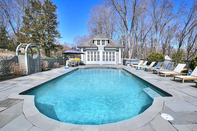 17 Wardwell Dr, New Canaan, CT 06840 - view of swimming pool featuring an exterior structure, an outbuilding, a patio, and fence
