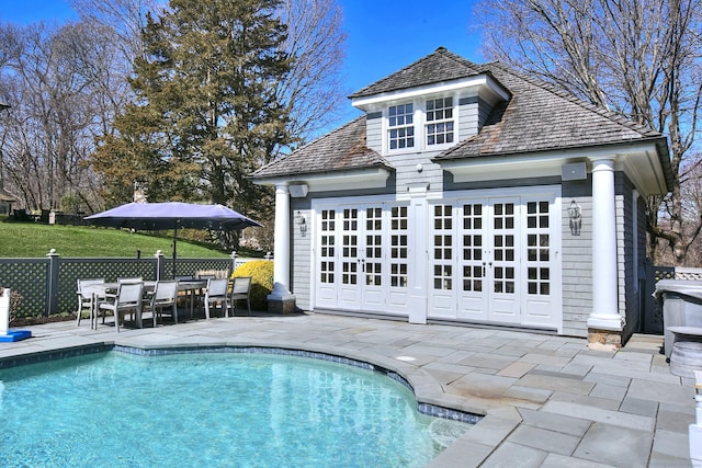 17 Wardwell Dr, New Canaan, CT 06840 - view of swimming pool with a storage structure, an outdoor structure, a patio, and fence
