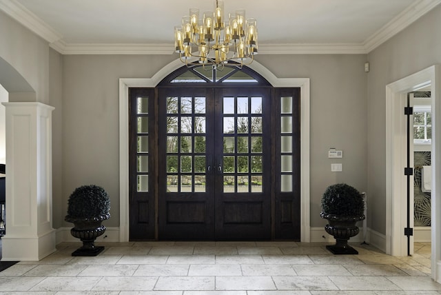 17 Wardwell Dr, New Canaan, CT 06840 - entryway with ornamental molding, a chandelier, baseboards, french doors, and ornate columns