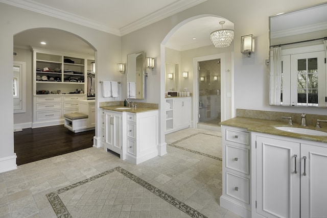 17 Wardwell Dr, New Canaan, CT 06840 - bathroom featuring inlaid floor details, a stall shower, crown molding, a spacious closet, and recessed lighting