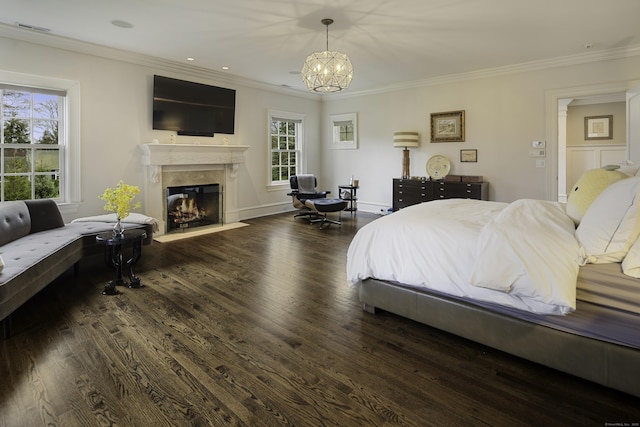 17 Wardwell Dr, New Canaan, CT 06840 - bedroom featuring wood finished floors, a premium fireplace, a chandelier, crown molding, and baseboards