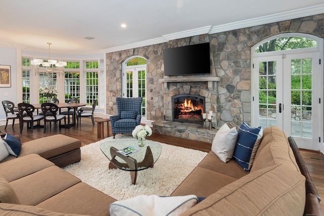 17 Wardwell Dr, New Canaan, CT 06840 - living room with french doors, crown molding, wood finished floors, and a fireplace