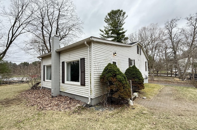 44 Red Bridge Rd, Thompson, CT 06255 - view of side of home with a chimney