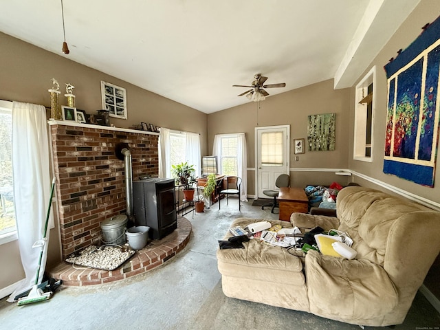 44 Red Bridge Rd, Thompson, CT 06255 - living area featuring a wood stove, a ceiling fan, concrete floors, and lofted ceiling
