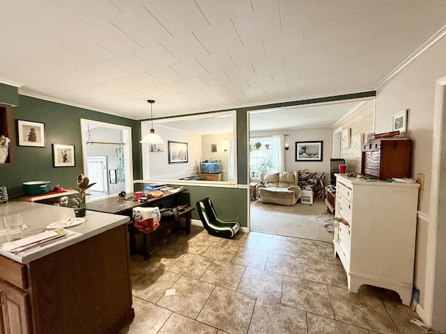 44 Red Bridge Rd, Thompson, CT 06255 - kitchen featuring crown molding, open floor plan, light countertops, light tile patterned floors, and hanging light fixtures