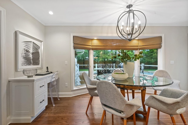 dining space featuring a chandelier, dark wood-type flooring, crown molding, baseboards, and recessed lighting