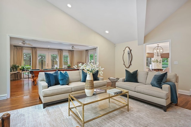 living room with plenty of natural light, wood finished floors, pool table, high vaulted ceiling, and recessed lighting