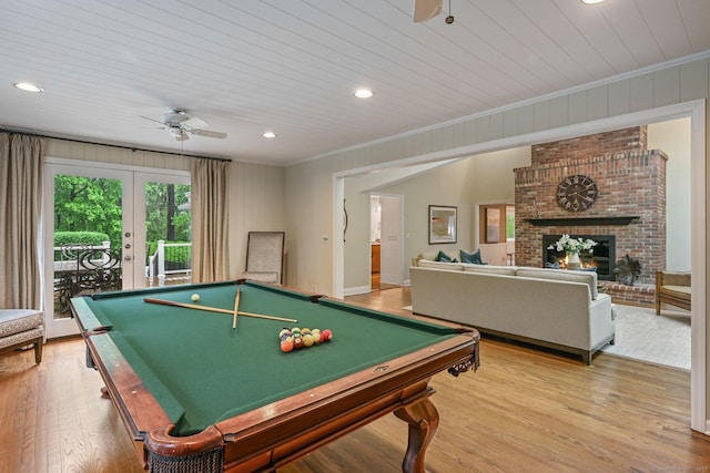 game room featuring a ceiling fan, ornamental molding, billiards table, light wood-style flooring, and french doors