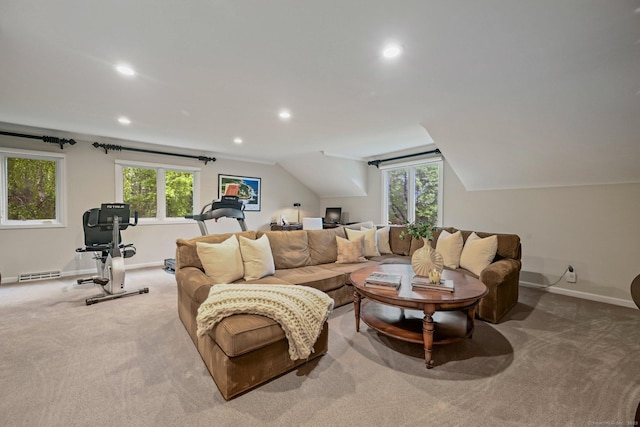 carpeted living area featuring baseboards, recessed lighting, plenty of natural light, lofted ceiling, and a desk