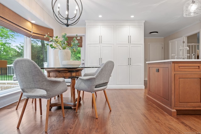 dining room with ornamental molding, plenty of natural light, a chandelier, light wood-style flooring, and recessed lighting