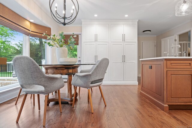 1 Braybourne Dr, Norwalk, CT 06855 - dining room with crown molding, healthy amount of natural light, a chandelier, light wood finished floors, and recessed lighting