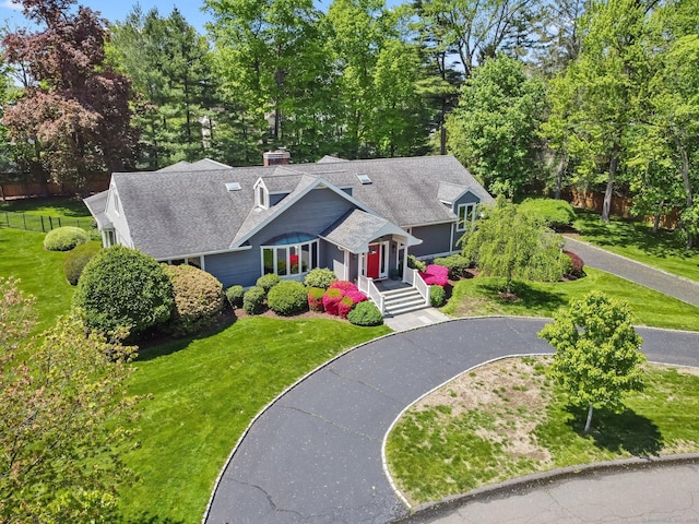 view from above of property featuring a tree filled landscape